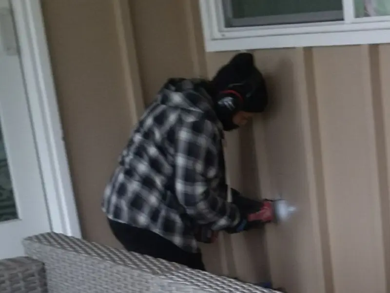 Professional electrician installing an exterior outlet in Millsboro