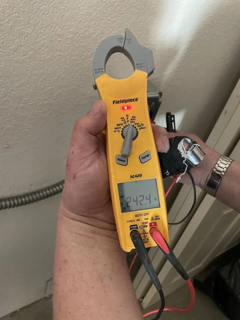 Voltage testing with clamp meter during Outlet Installation in Millsboro